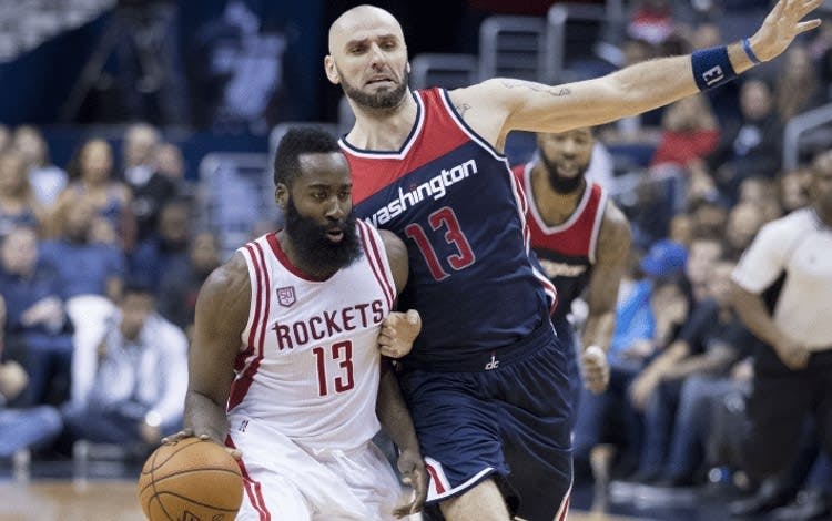 James Harden playing for the Houston Rockets vs Marcin Gortat From the Washington Wizards
