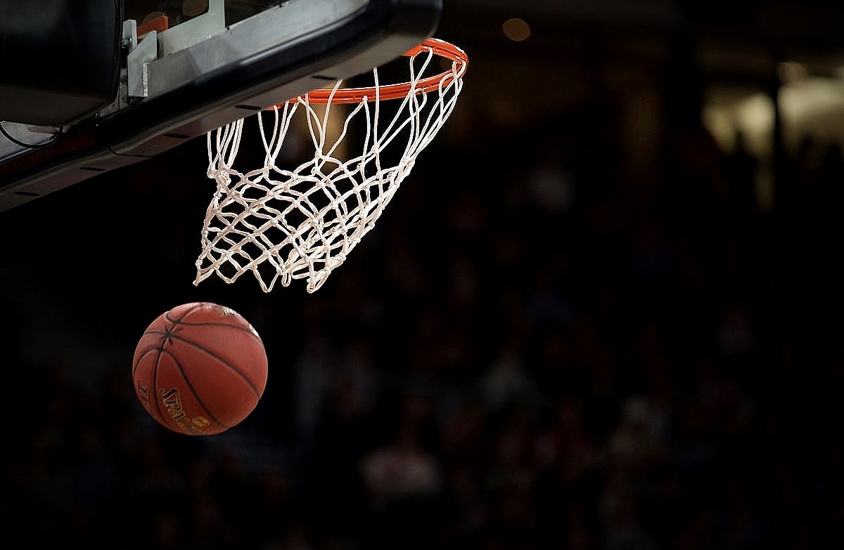 A basketball on a hardwood court