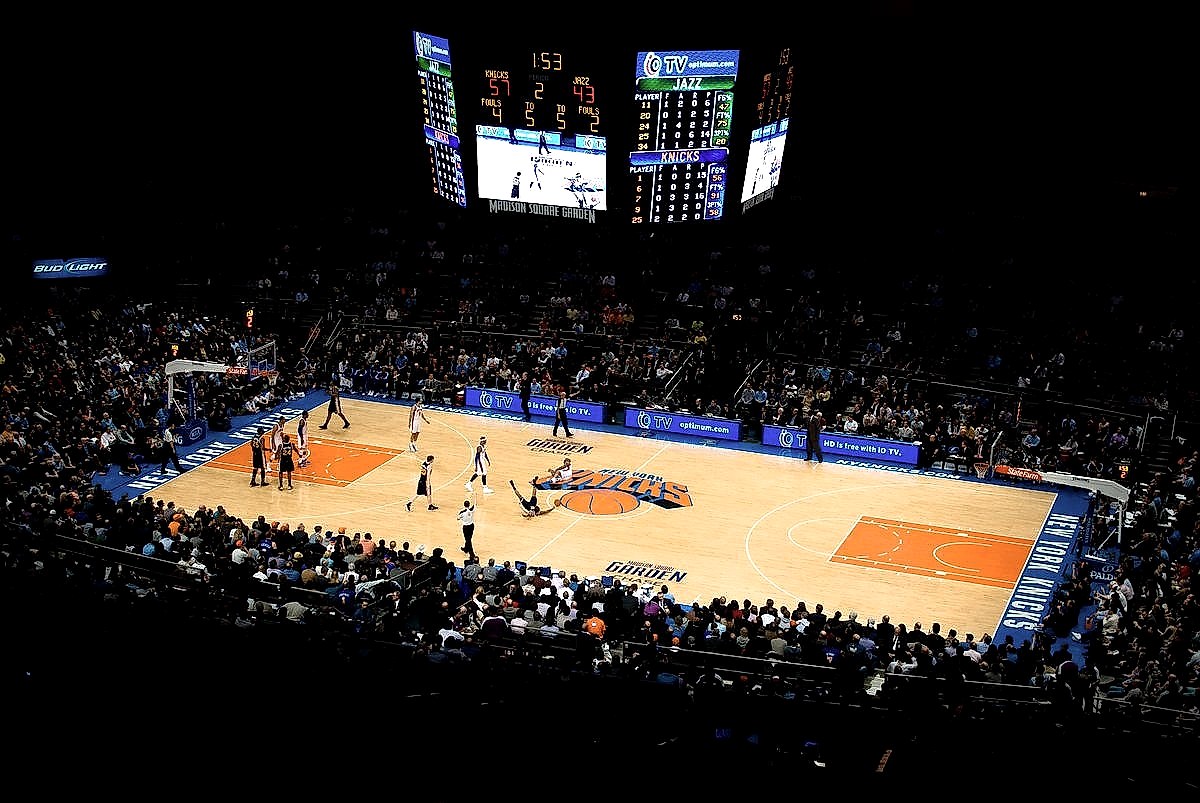 Madison Square Garden interior during a New York Knicks game, showing the court and packed stands