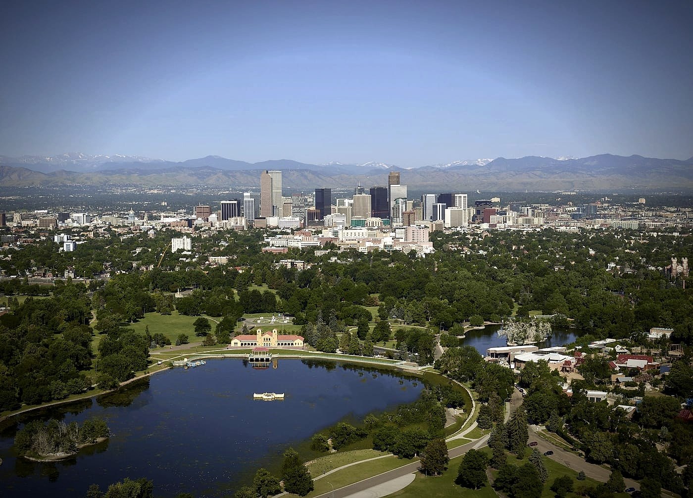 Aerial view of Denver, Colorado, with the downtown skyline and the Front Range behind it