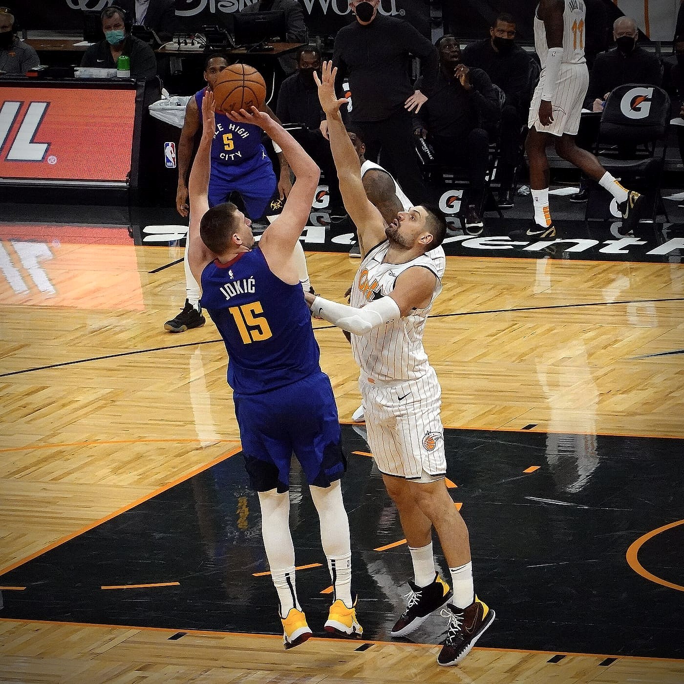 Nikola Jokic rising for a jump shot in a Denver Nuggets number 15 jersey