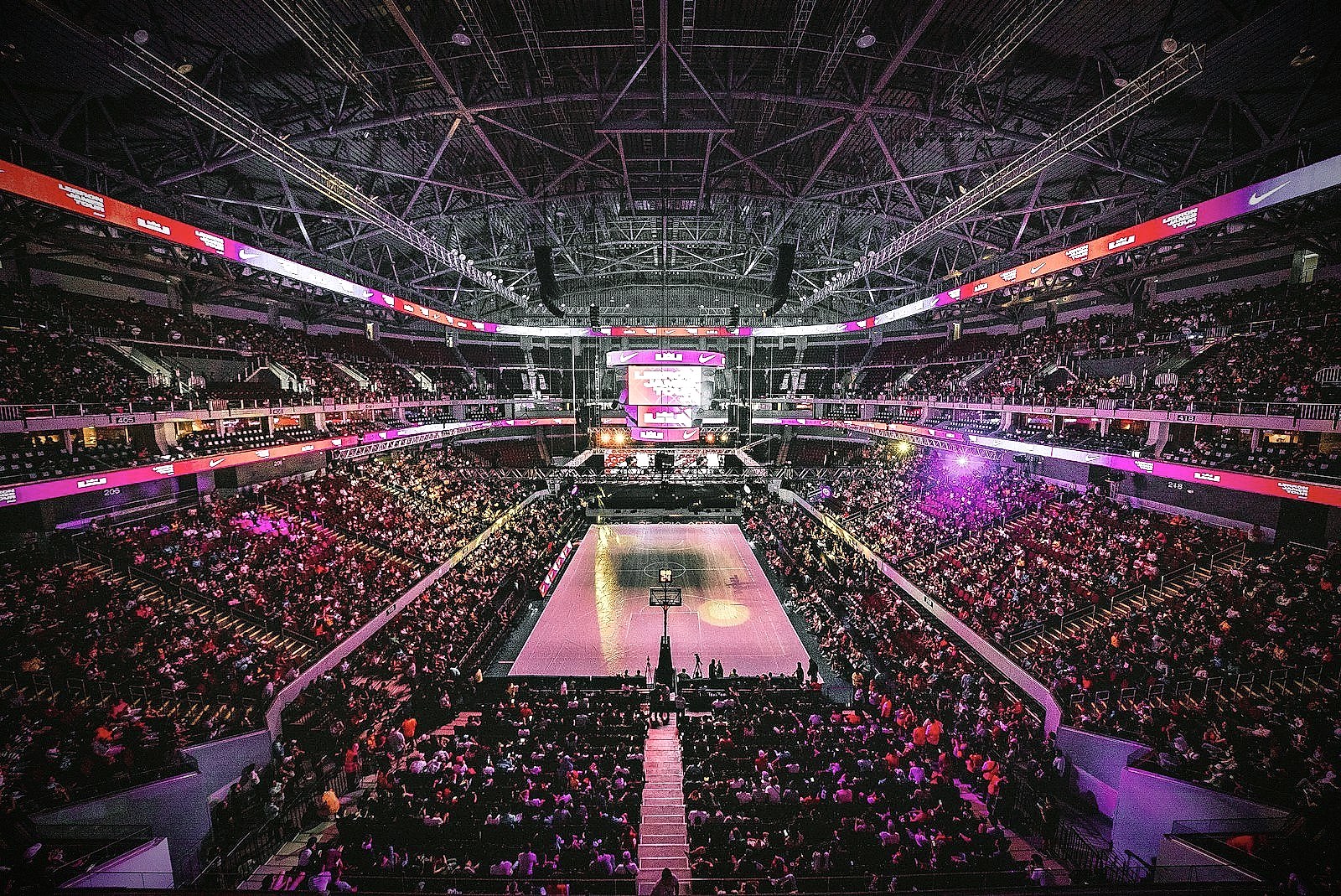 Interior of an NBA arena during a game, viewed from the lower bowl