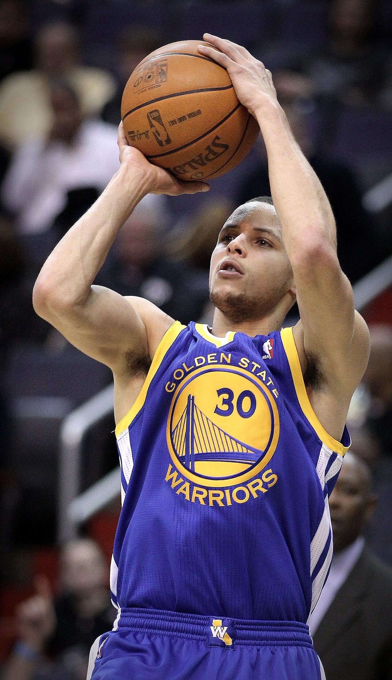 Stephen Curry shooting a three-pointer